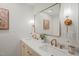 Elegant bathroom featuring double vanity, a framed mirror and modern fixtures at 1621 N Park Ave, Burlington, NC 27217