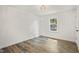 Bright bedroom showcasing a window and hardwood floors at 1621 N Park Ave, Burlington, NC 27217