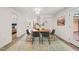 Dining area featuring modern table set and hardwood-style flooring, open to other rooms at 1621 N Park Ave, Burlington, NC 27217