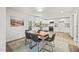 Eat in kitchen with stainless appliances, sleek white cabinets and wood floors at 1621 N Park Ave, Burlington, NC 27217
