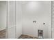 Practical laundry room featuring white walls, tile flooring, and washer/dryer hookups at 1621 N Park Ave, Burlington, NC 27217
