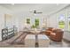 Bright and inviting living room with stylish furnishings and ample natural light from surrounding windows at 1621 N Park Ave, Burlington, NC 27217