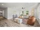 Bright and modern living room featuring recessed lighting, wood floors and stylish furnishings at 1621 N Park Ave, Burlington, NC 27217