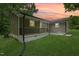 Photo showcasing the rear exterior with a porch, siding and manicured lawn at 1621 N Park Ave, Burlington, NC 27217