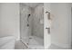 Luxurious bathroom boasting a glass-enclosed shower, tiled walls, and stylish fixtures at 1672 Wheeler Dr, Angier, NC 27501