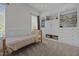Cozy bedroom featuring built-in shelving, storage, and a window for natural light at 1672 Wheeler Dr, Angier, NC 27501