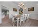 Elegant dining room featuring a wood table, designer lighting, and classic decor at 1672 Wheeler Dr, Angier, NC 27501