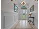 Elegant foyer with decorative flooring, high ceilings, chandelier, and a view of the front door at 1672 Wheeler Dr, Angier, NC 27501