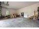 Spacious garage featuring ample storage, natural light, and convenient access to the house at 1672 Wheeler Dr, Angier, NC 27501
