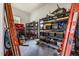 Well-organized garage storage with shelving units containing tools and equipment at 1672 Wheeler Dr, Angier, NC 27501