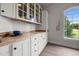 Bright kitchen showcasing custom cabinets and butcher block countertops, illuminated by a large window at 1672 Wheeler Dr, Angier, NC 27501