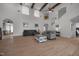 Spacious living room featuring high ceilings, neutral walls, comfortable seating, and arched doorways at 1672 Wheeler Dr, Angier, NC 27501