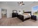 Relaxing bedroom with a ceiling fan and an open view to the kitchen/dining area at 1672 Wheeler Dr, Angier, NC 27501