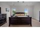 Comfortable bedroom featuring large windows, neutral decor, and a cozy atmosphere at 1672 Wheeler Dr, Angier, NC 27501