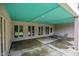 Outdoor patio space with a teal ceiling and patio furniture at 1672 Wheeler Dr, Angier, NC 27501