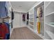 Spacious walk-in closet with ample shelving and hanging space, perfect for organizing clothes and accessories at 1672 Wheeler Dr, Angier, NC 27501