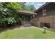 Covered patio swing overlooking green yard at 1705 Nottingham Rd, Raleigh, NC 27607