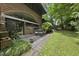Backyard patio with outdoor seating surrounded by lush greenery at 1705 Nottingham Rd, Raleigh, NC 27607