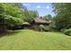 Green backyard featuring a covered patio swing at 1705 Nottingham Rd, Raleigh, NC 27607