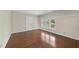 Bright bedroom with a window and hardwood floors at 1705 Nottingham Rd, Raleigh, NC 27607