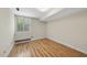 Bright bedroom with a window and hardwood floors at 1705 Nottingham Rd, Raleigh, NC 27607