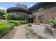 Unique brick home with beautiful landscaping and a curved entrance, offering curb appeal at 1705 Nottingham Rd, Raleigh, NC 27607