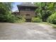 Brick home with unique architectural design and well-maintained landscaping at 1705 Nottingham Rd, Raleigh, NC 27607