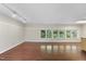 Spacious living room with hardwood floors, natural light and neutral paint at 1705 Nottingham Rd, Raleigh, NC 27607