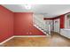 Open-concept living area with staircase and parquet floors for a bright, spacious feel at 1705 Nottingham Rd, Raleigh, NC 27607