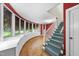 Bright living room featuring a curved window wall with built-in storage and hardwood floors at 1705 Nottingham Rd, Raleigh, NC 27607