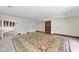 A spacious living area features a beautiful area rug and custom built-ins at 1705 Nottingham Rd, Raleigh, NC 27607