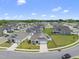 Aerial view of a well-maintained neighborhood with landscaped lawns and modern homes at 1727 Pinecliff Ct, Fuquay Varina, NC 27526