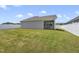Well-manicured backyard with an adjacent screened porch and fence at 1727 Pinecliff Ct, Fuquay Varina, NC 27526