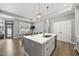 Open concept kitchen with an island overlooking the dining area, creating a seamless flow for entertaining at 1727 Pinecliff Ct, Fuquay Varina, NC 27526