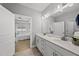 Bathroom featuring double sinks, quartz countertops, and tile flooring at 1727 Pinecliff Ct, Fuquay Varina, NC 27526