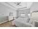 Comfortable main bedroom with a ceiling fan and access to a private balcony at 1727 Pinecliff Ct, Fuquay Varina, NC 27526
