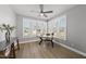 Inviting office space with abundant natural light from large windows, perfect for a productive work environment at 1727 Pinecliff Ct, Fuquay Varina, NC 27526