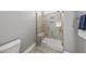 Tiled shower with bench seating and glass door at 1727 Pinecliff Ct, Fuquay Varina, NC 27526