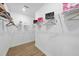 Spacious walk-in closet with white shelving and ample storage space for clothes and accessories at 1727 Pinecliff Ct, Fuquay Varina, NC 27526