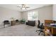 Spacious room with neutral walls, a ceiling fan, a window, and carpeted floors; perfect for a home office at 1831 Middlebrook Dr, Raleigh, NC 27615