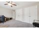 Large room with a closet and a ceiling fan is brightened by natural light, offers ample closet space, and soft carpeting at 1831 Middlebrook Dr, Raleigh, NC 27615