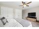 Comfortable bedroom featuring lots of closet space, a ceiling fan, and neutral decor at 1831 Middlebrook Dr, Raleigh, NC 27615