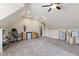Versatile bonus room featuring a wet bar, ample space, and a neutral color palette for a custom living area at 1831 Middlebrook Dr, Raleigh, NC 27615