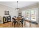 Charming dining room with hardwood floors and French doors leading to the outdoors at 1831 Middlebrook Dr, Raleigh, NC 27615