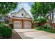Charming two-story home with a brick front, two-car garage and a landscaped yard at 1831 Middlebrook Dr, Raleigh, NC 27615