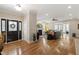 Inviting foyer with hardwood floors that flows into an open-concept living area, featuring a decorative door at 1831 Middlebrook Dr, Raleigh, NC 27615