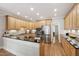Spacious kitchen boasts stainless steel appliances, granite countertops, and light wood cabinets at 1831 Middlebrook Dr, Raleigh, NC 27615