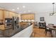 Open-concept kitchen with stainless steel appliances, granite counters, and adjacent dining area at 1831 Middlebrook Dr, Raleigh, NC 27615