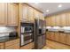 Kitchen featuring built-in stainless steel appliances and hardwood floors throughout at 1831 Middlebrook Dr, Raleigh, NC 27615