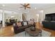 Open concept living room with hardwood floors, staircase, and comfortable seating at 1831 Middlebrook Dr, Raleigh, NC 27615